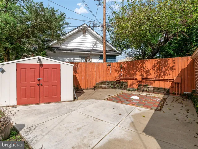 a view of a backyard with a garden and plants