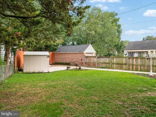 an aerial view of residential houses with outdoor space and river