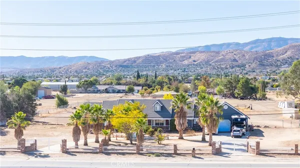 a view of a swimming pool with mountains in the background