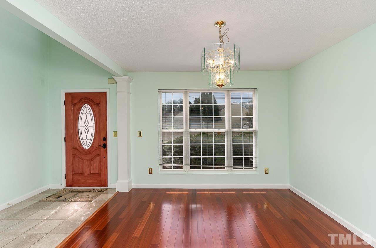 5601 Orchard Gate Way Raleigh, NC 27616 - Photo 3 of 28 wooden floor in an empty room with a window
