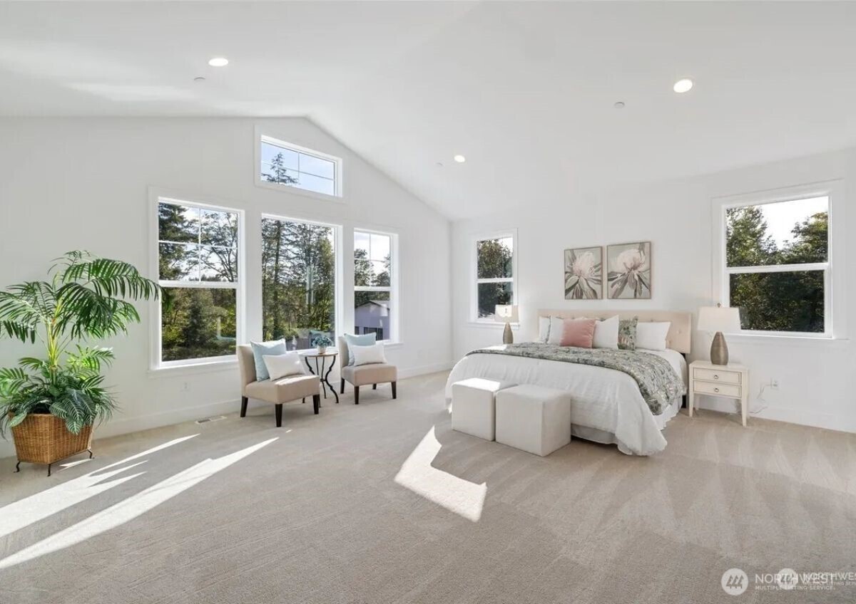 15410 Northeast 103rd Way Redmond, WA 98052 - Photo 12 of 20 a spacious bedroom with a large bed and a potted plant