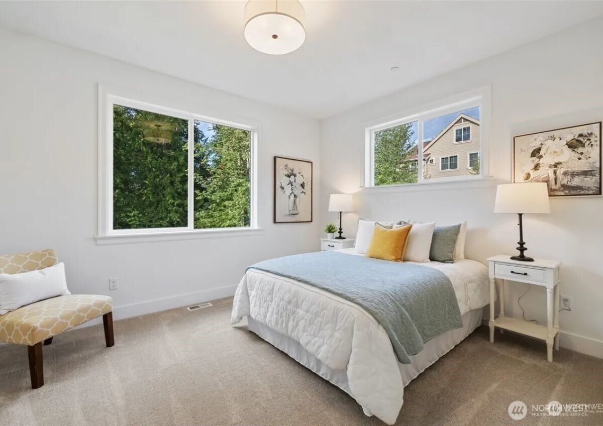 15410 Northeast 103rd Way Redmond, WA 98052 - Photo 15 of 20 a bedroom with a bed and a couch