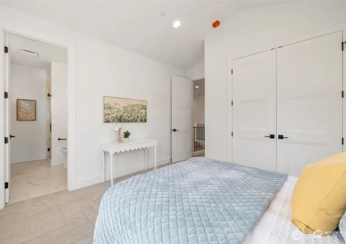 15410 Northeast 103rd Way Redmond, WA 98052 - Photo 16 of 20 a bedroom with a bed and a couch