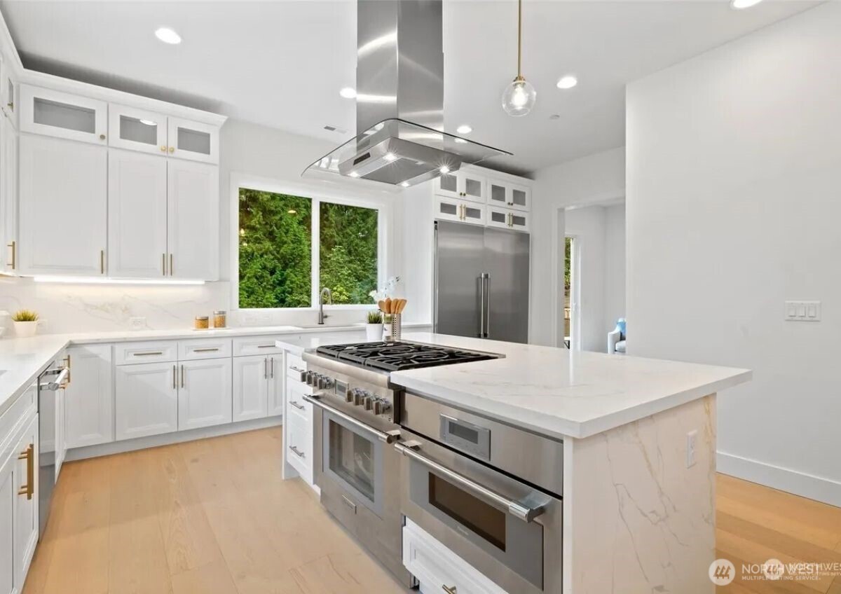 15410 Northeast 103rd Way Redmond, WA 98052 - Photo 7 of 20 a kitchen that has a sink a stove and a window