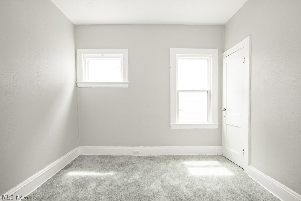 1000 Eddy Road Cleveland, OH 44108 - Photo 14 of 38 Spare room with light colored carpet and baseboards
