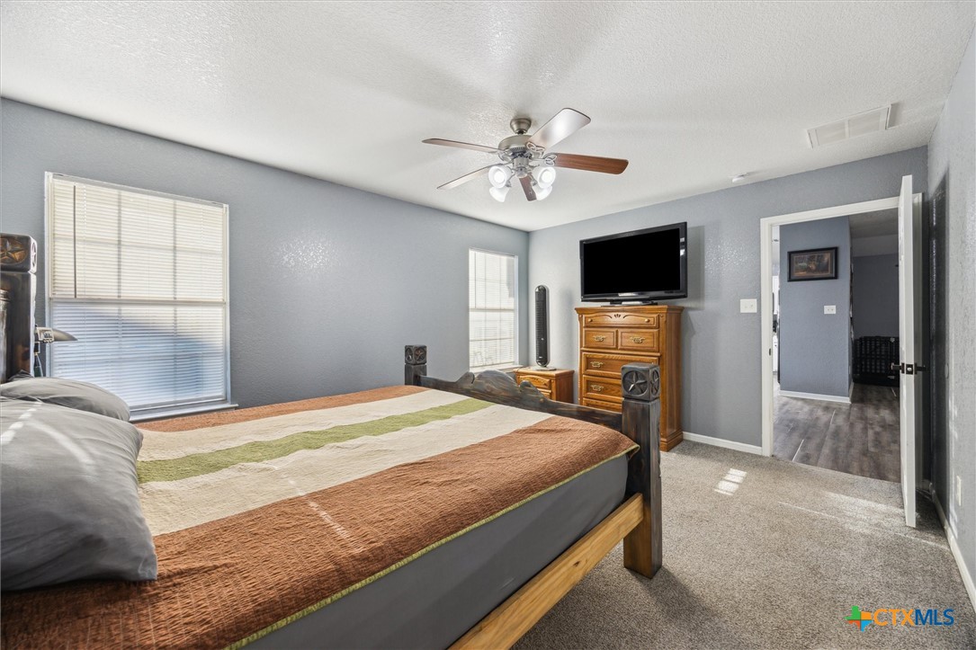 1220 Redstone Drive Temple, TX 76502 - Photo 18 of 35 a bedroom with a bed and a tv