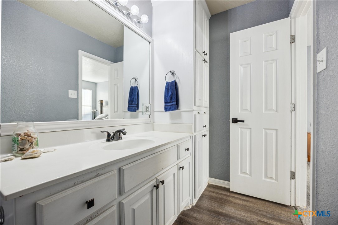 1220 Redstone Drive Temple, TX 76502 - Photo 20 of 35 a bathroom with a double vanity sink and a mirror