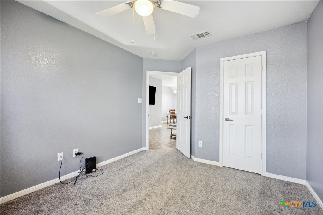 1220 Redstone Drive Temple, TX 76502 - Photo 26 of 35 a view of a room with a sink and a mirror