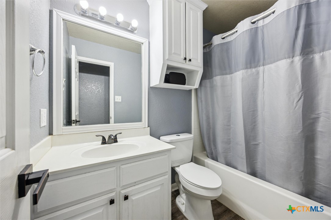 1220 Redstone Drive Temple, TX 76502 - Photo 27 of 35 a bathroom with a sink toilet and shower