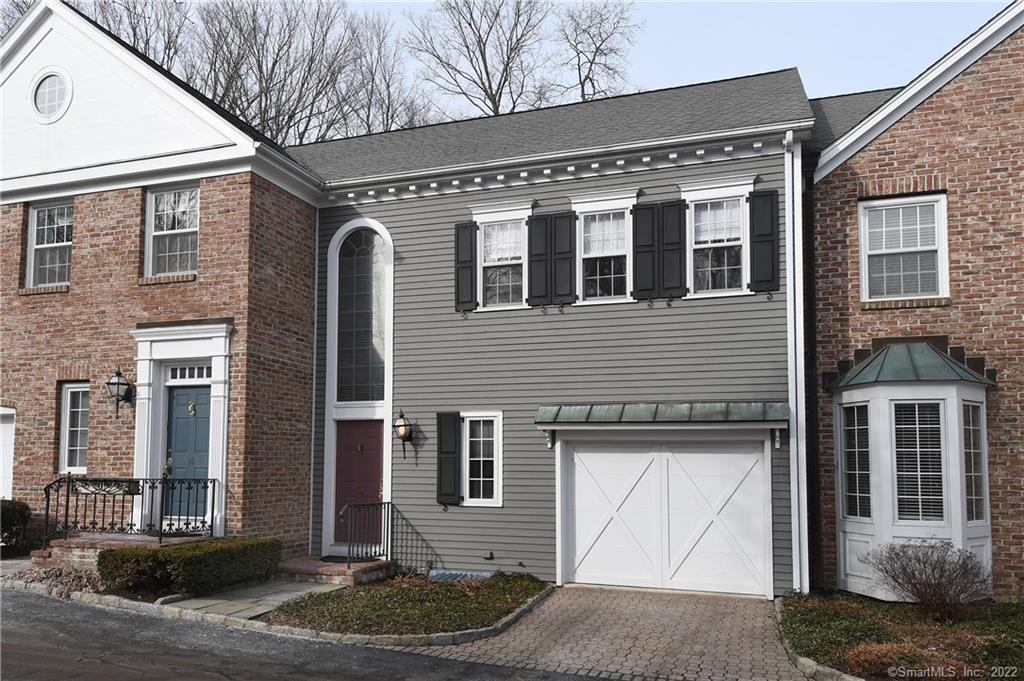 520 Main Street, Unit 13 Ridgefield, CT 06877 - Photo 1 of 1 a front view of a house with garden