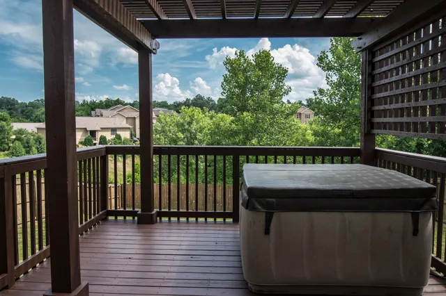 a view of a balcony with wooden floor