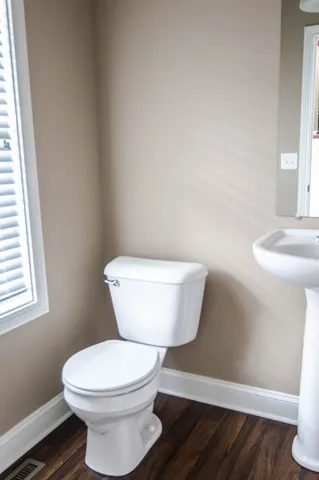 a bathroom with a toilet and a sink