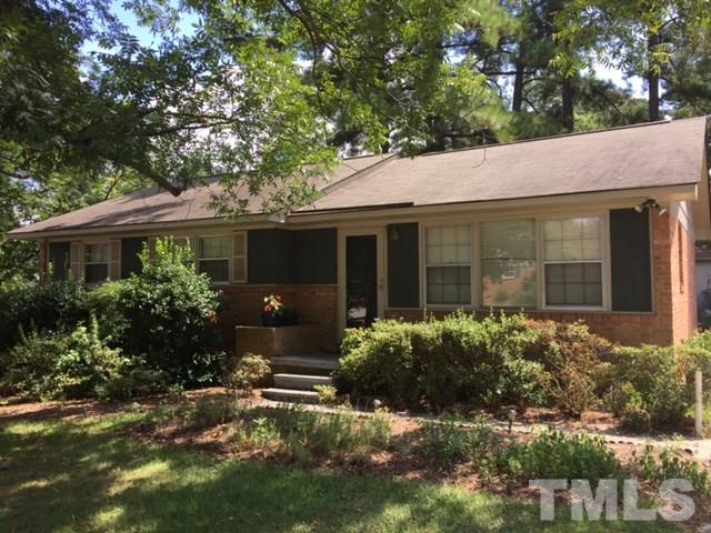140 East Rowan Street Raleigh, NC 27609 - Photo 2 of 4 a front view of a house with a yard