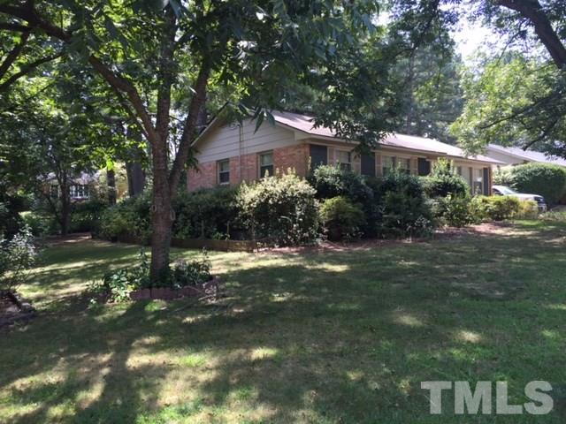 140 East Rowan Street Raleigh, NC 27609 - Photo 3 of 4 a front view of a house with a yard