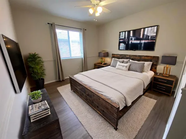 an empty room with wooden floor and closet