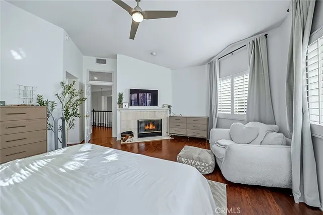 a large white bathroom with a tub a sink a mirror and a shower