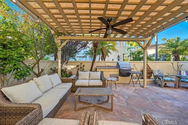 a outdoor living space with furniture and a rug