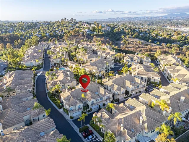 a vase of flowers sitting on a floor