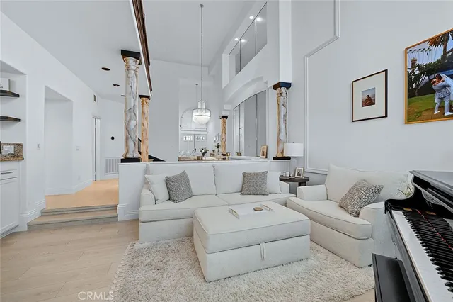 a view of a kitchen with white cabinets