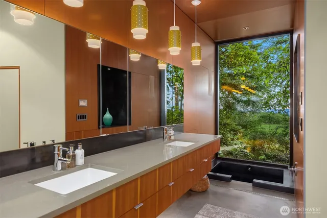 a view of a room with furniture and wooden floor