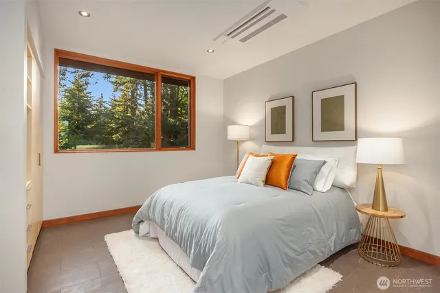 a bathroom with a double vanity sink and mirror