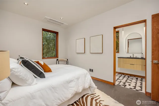an aerial view of a house with a yard swimming pool and outdoor seating