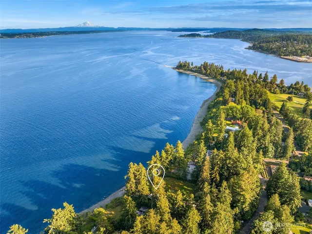 a view of an ocean with a mountain view