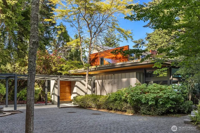 front view of a house with a tree