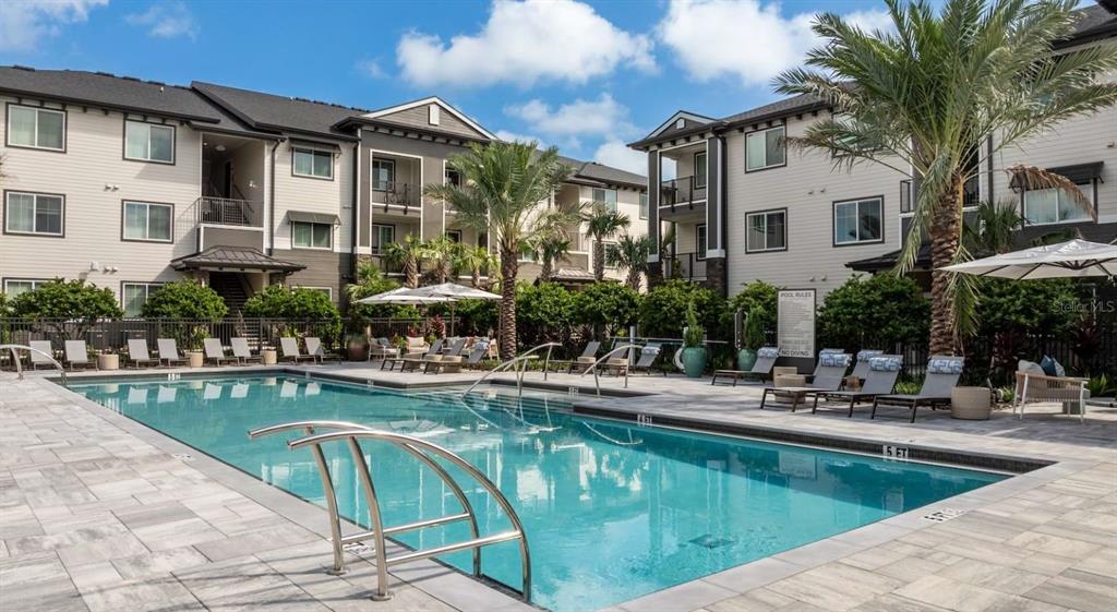 5000 Collina Terrace, Unit TH1 Clermont, FL 34711 - Photo 21 of 28 a view of a house with swimming pool