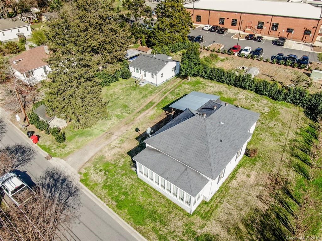 504 Watson Street Davidson, NC 28036 - Photo 2 of 35 an aerial view of a house with a yard and trees