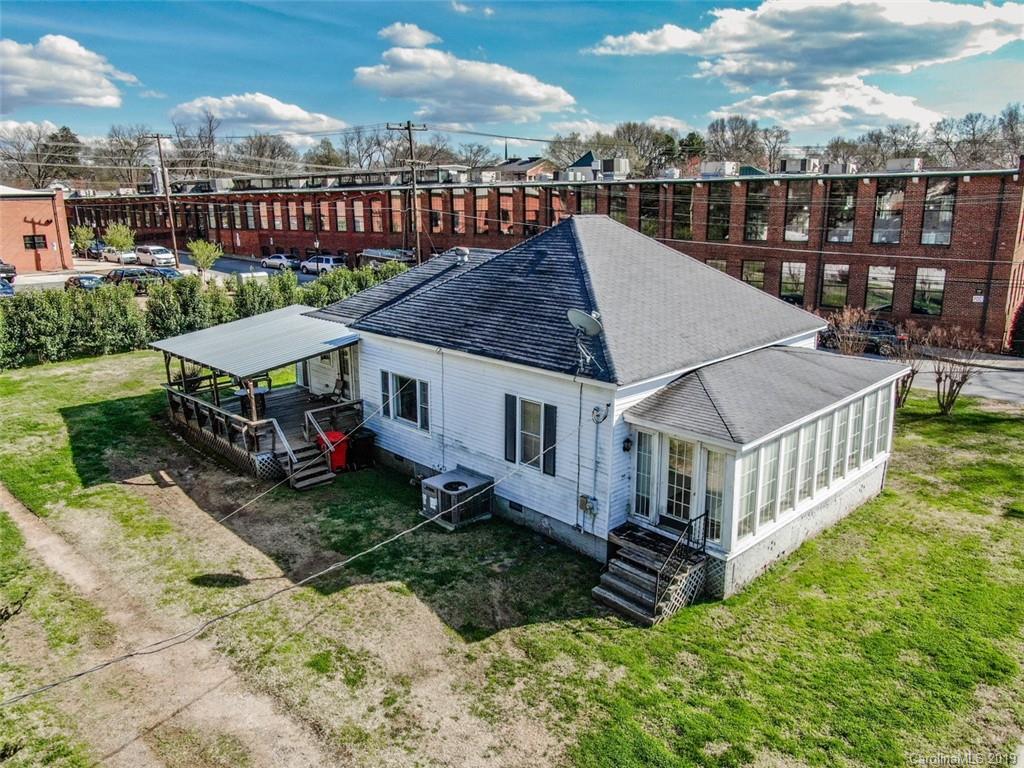 504 Watson Street Davidson, NC 28036 - Photo 11 of 35 a view of a house with wooden floor and a yard