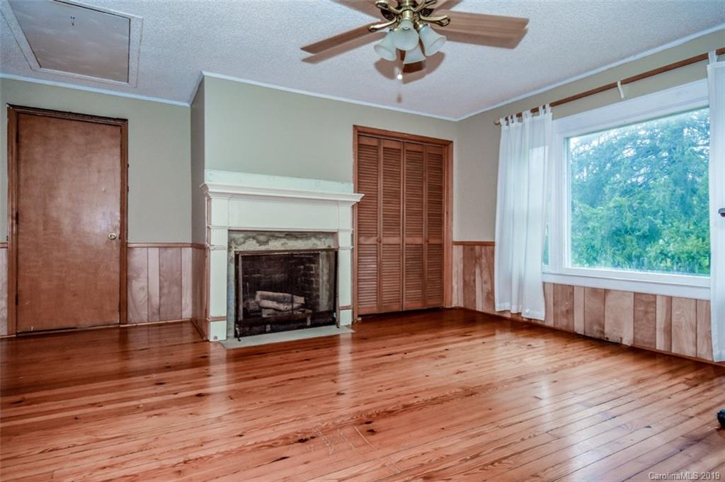 504 Watson Street Davidson, NC 28036 - Photo 19 of 35 a view of a livingroom with a fireplace and window