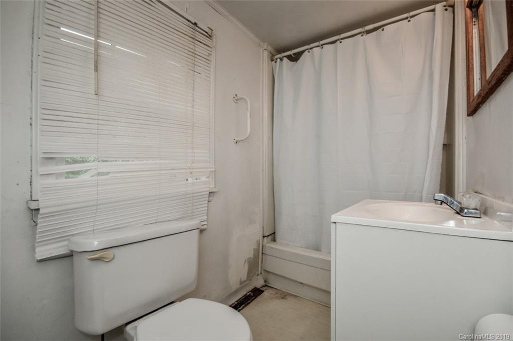 504 Watson Street Davidson, NC 28036 - Photo 24 of 35 a bathroom with a sink a toilet and shower