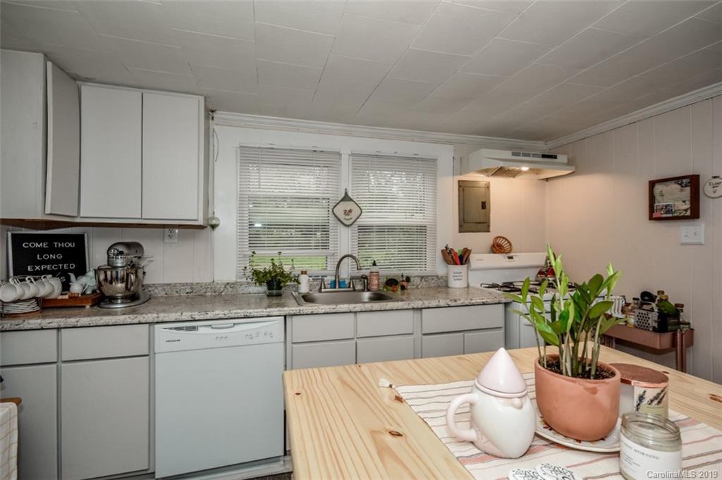 504 Watson Street Davidson, NC 28036 - Photo 26 of 35 a kitchen with a sink and cabinets