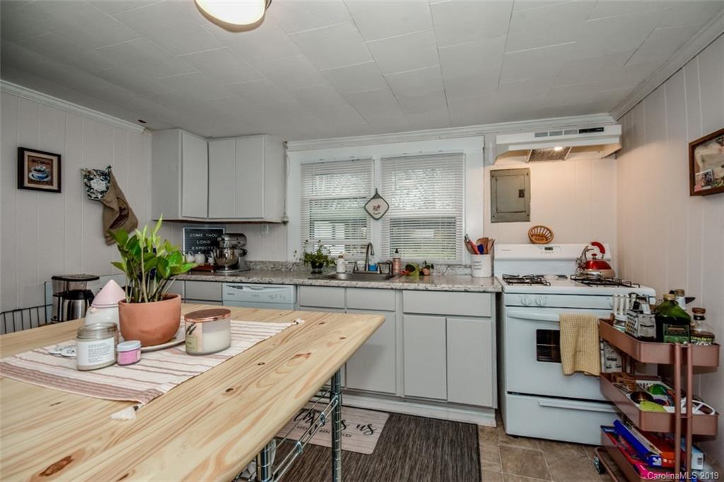 504 Watson Street Davidson, NC 28036 - Photo 27 of 35 a kitchen with a table and chairs in it