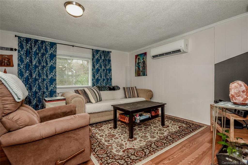 504 Watson Street Davidson, NC 28036 - Photo 30 of 35 a living room with furniture and a rug