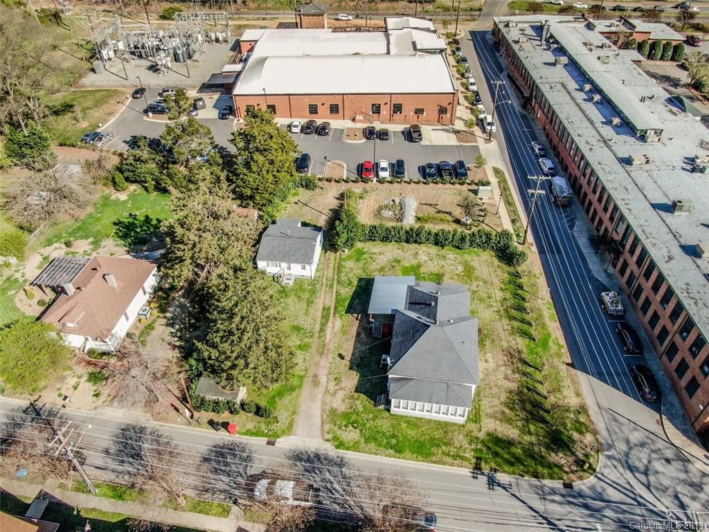 504 Watson Street Davidson, NC 28036 - Photo 4 of 35 a aerial view of multi story residential apartment building with yard and parking space