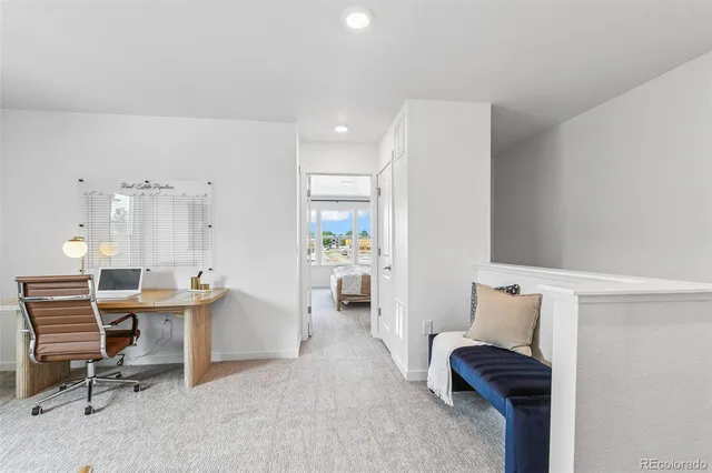 a view of a workspace with furniture and a couch