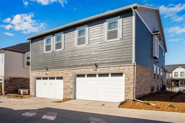 a front view of a house with a garage