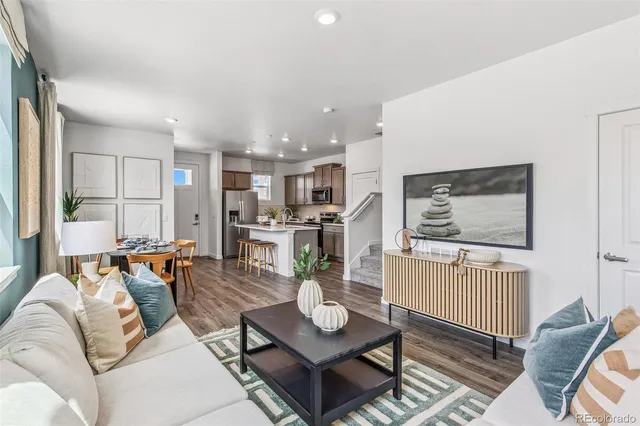 a living room with furniture and a table