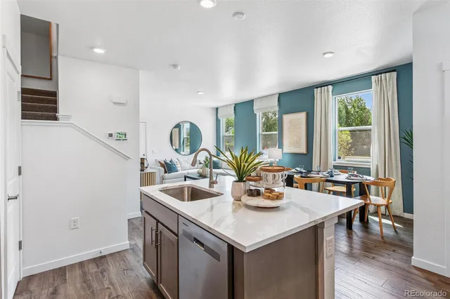 a kitchen with a sink and wooden cabinets