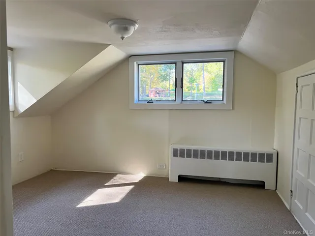 a view of a hallway with a window