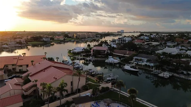an aerial view of multiple houses with yard