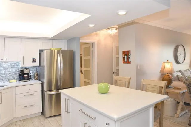 a kitchen with a refrigerator a sink and dishwasher