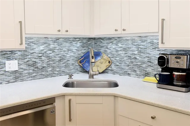 a kitchen with a sink and a stove