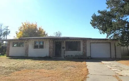 a house with trees in the background