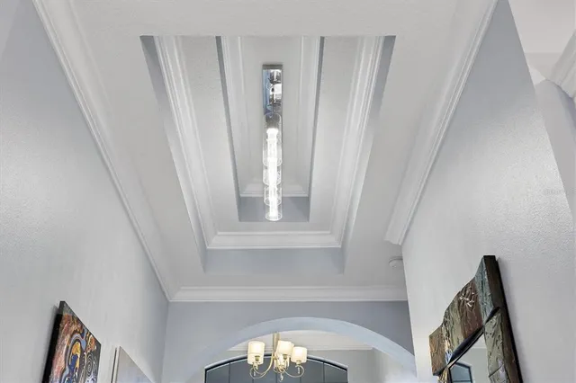 a living room with furniture and a view of kitchen