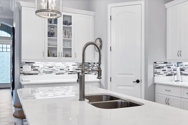 a kitchen with a stove sink and refrigerator