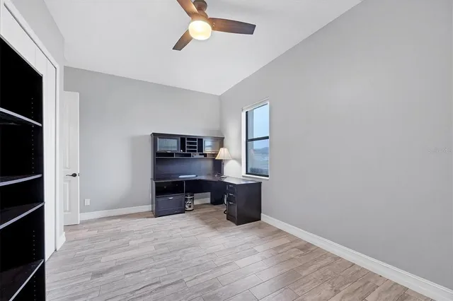 a room with lots of windows and glass door