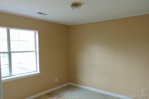 10303 Rockwood Road Charlotte, NC 28215 - Photo 5 of 12 an empty room with a window